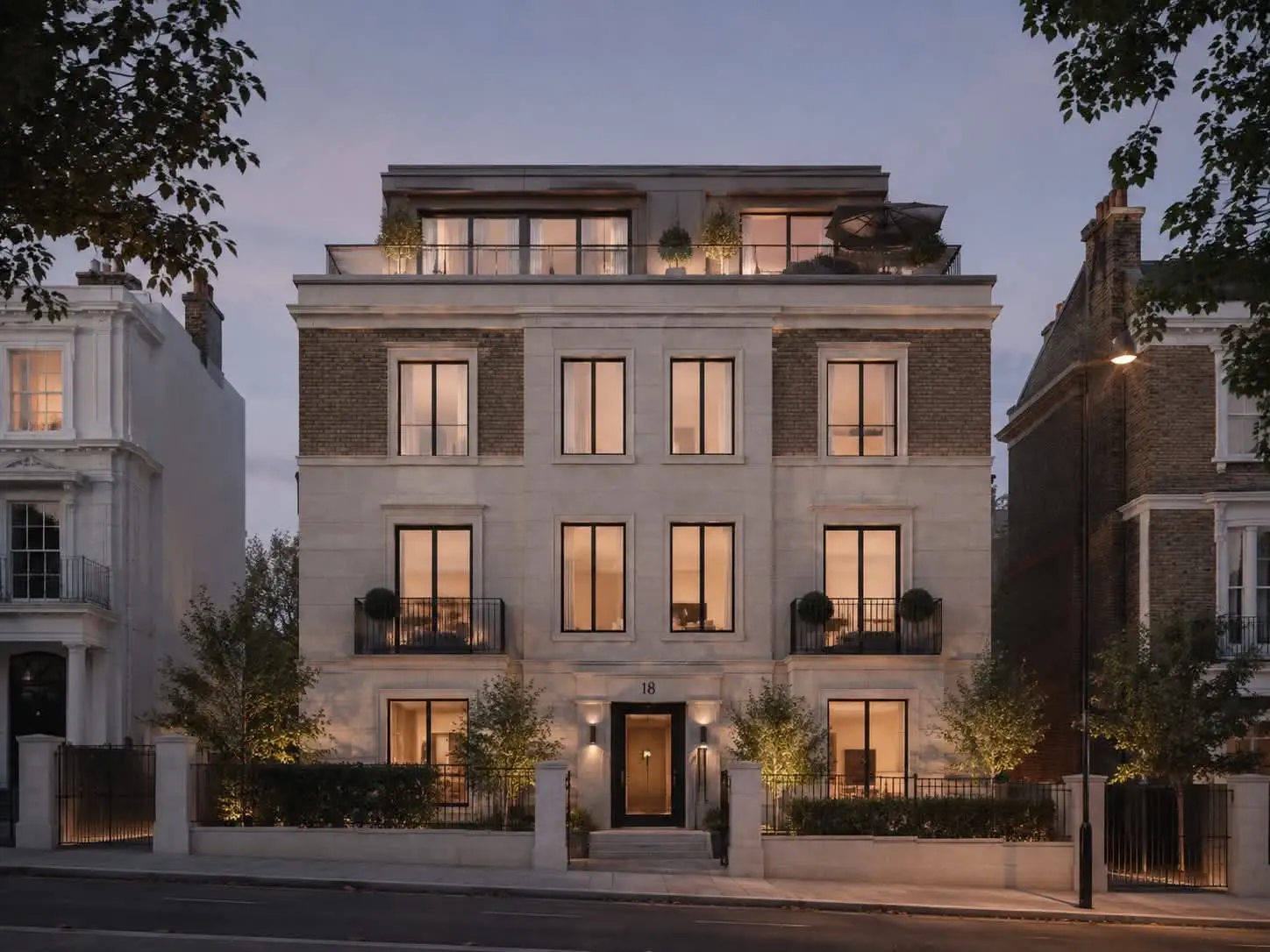 Exterior view of a luxury residential building at dusk in London, location of The Kensington Crown Penthouse underfloor heating project